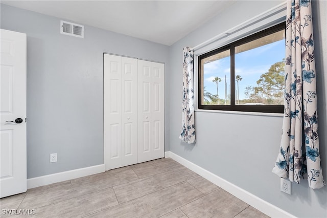 unfurnished bedroom featuring a closet