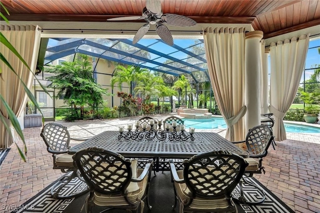 view of patio / terrace with a lanai and ceiling fan