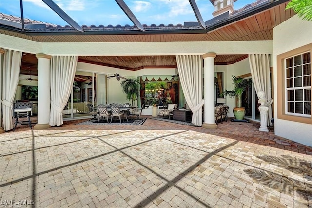 view of patio featuring ceiling fan