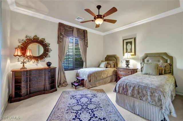 carpeted bedroom with ceiling fan and ornamental molding