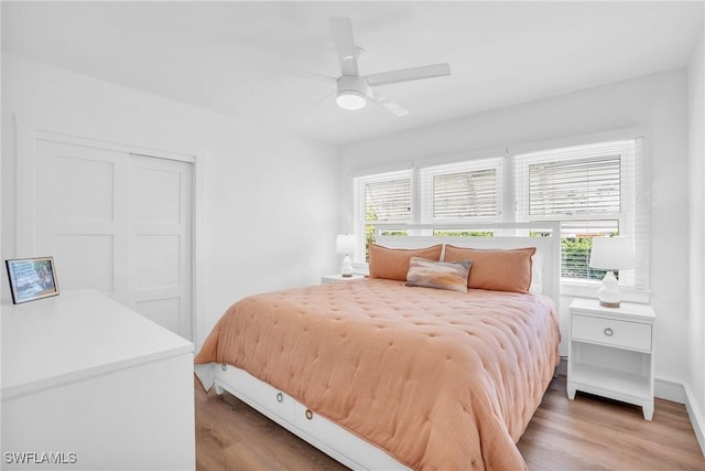 bedroom with hardwood / wood-style flooring and ceiling fan