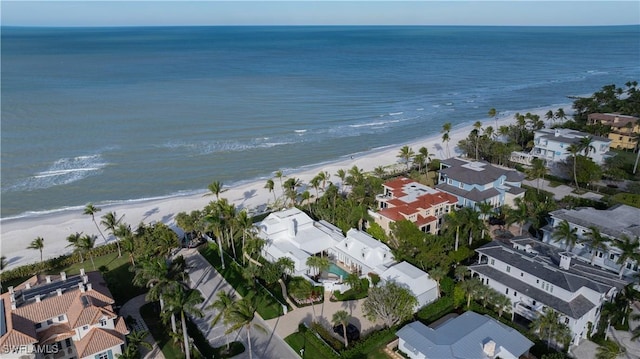 aerial view with a water view and a view of the beach