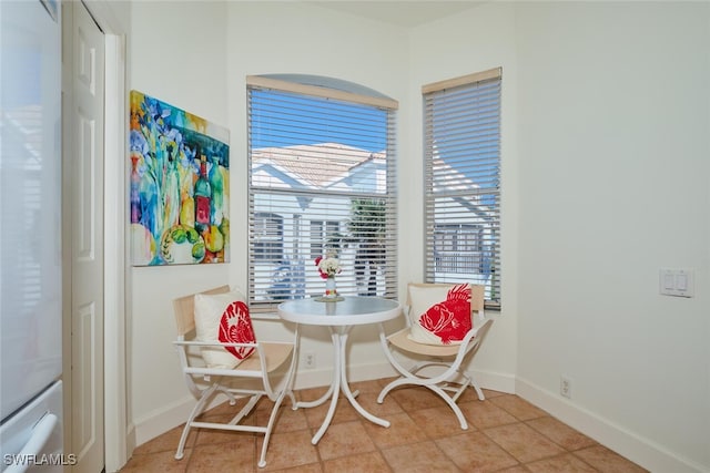 dining space with light tile patterned floors