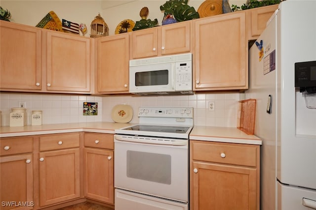 kitchen featuring light brown cabinets, white appliances, and backsplash