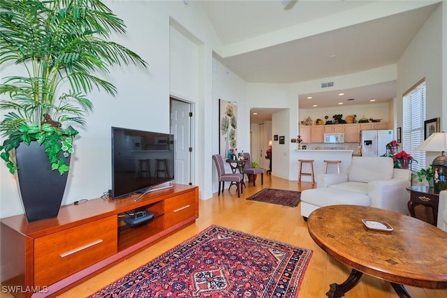 living room with light hardwood / wood-style floors