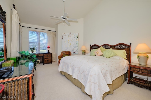 bedroom with ceiling fan and carpet floors