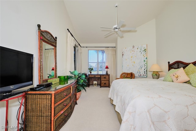 bedroom with ceiling fan, carpet, and lofted ceiling