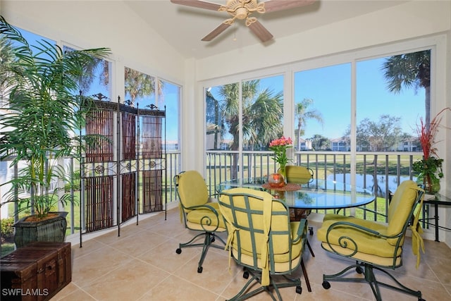 sunroom with ceiling fan and lofted ceiling