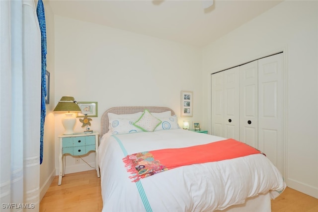 bedroom featuring hardwood / wood-style flooring and a closet