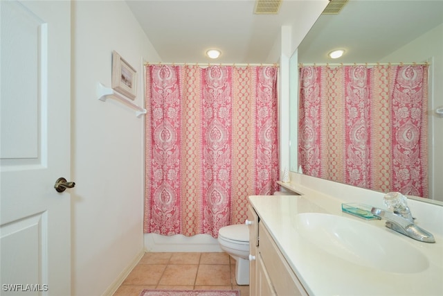 full bathroom featuring tile patterned flooring, vanity, toilet, and shower / bath combo with shower curtain