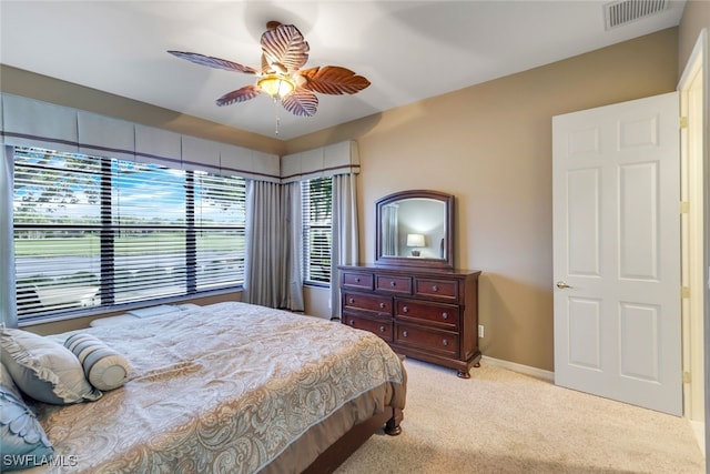 bedroom featuring ceiling fan and light colored carpet