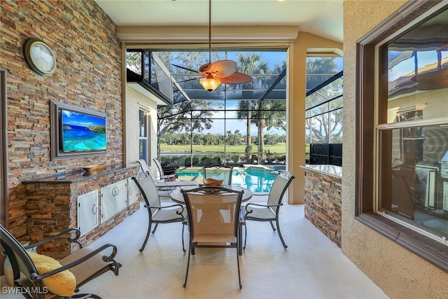 sunroom featuring vaulted ceiling