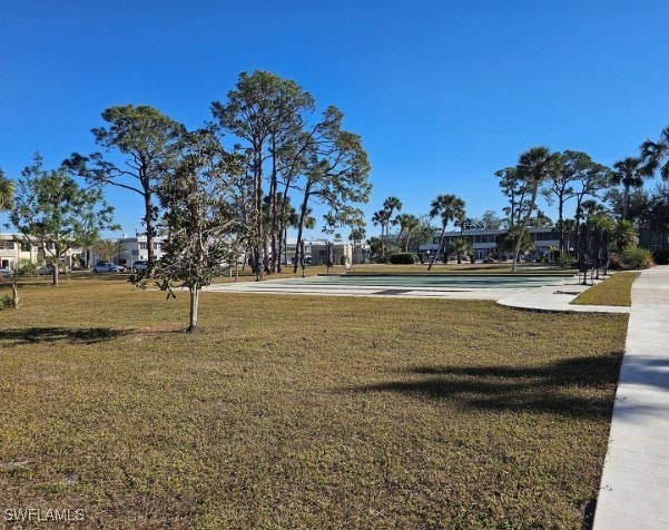 view of community featuring a yard