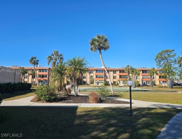 surrounding community featuring a lawn