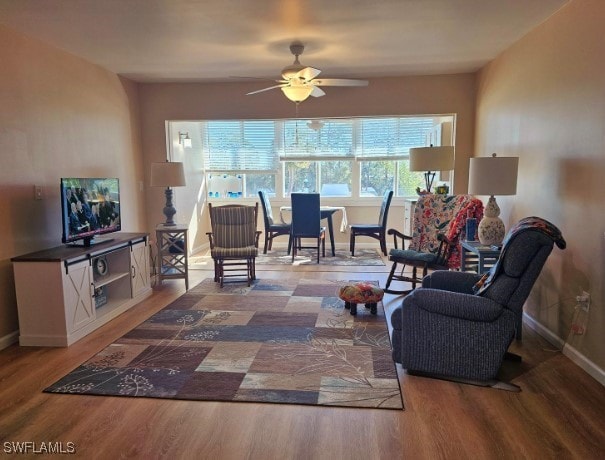 living room with hardwood / wood-style flooring and ceiling fan