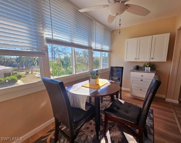 dining room with wood-type flooring and ceiling fan