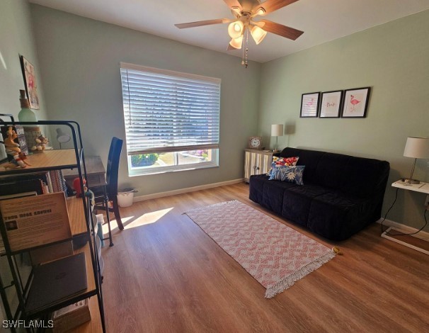 office area featuring wood-type flooring and ceiling fan