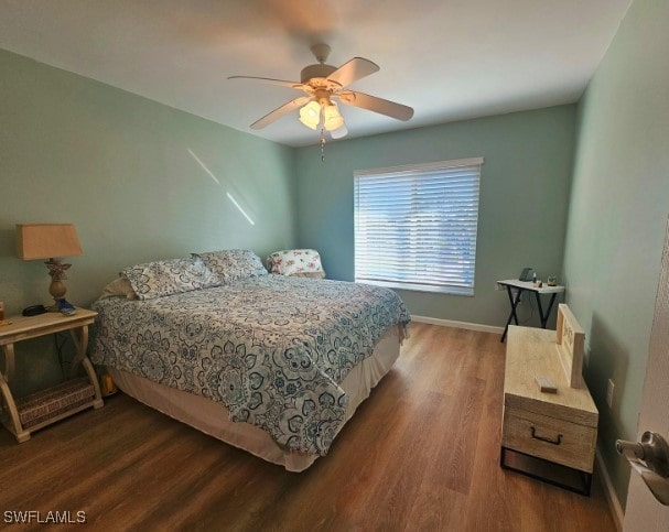 bedroom featuring dark hardwood / wood-style floors and ceiling fan