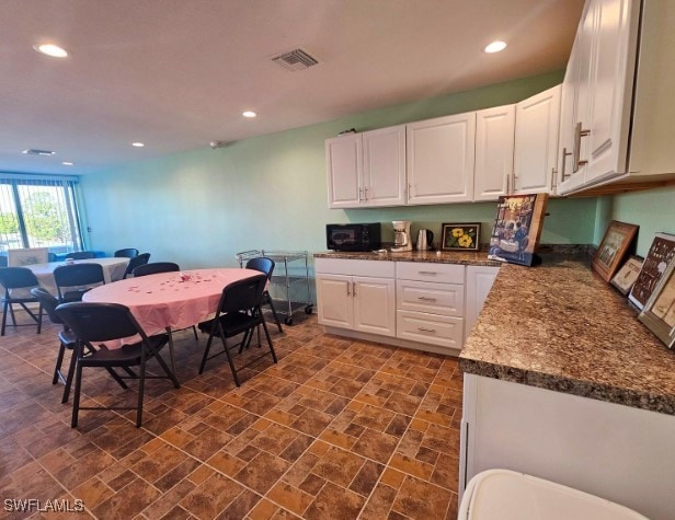 kitchen with white cabinets