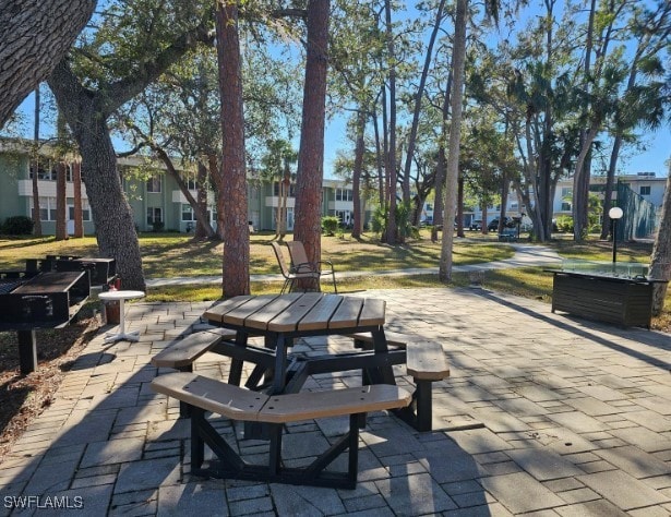 view of property's community with a patio area