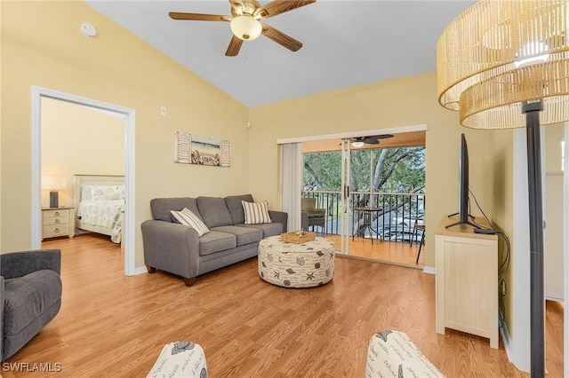 living room with ceiling fan, wood finished floors, high vaulted ceiling, and baseboards
