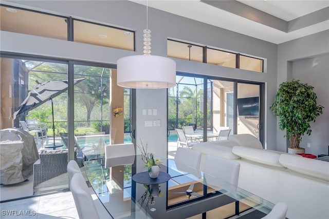 living room featuring tile patterned floors and a healthy amount of sunlight