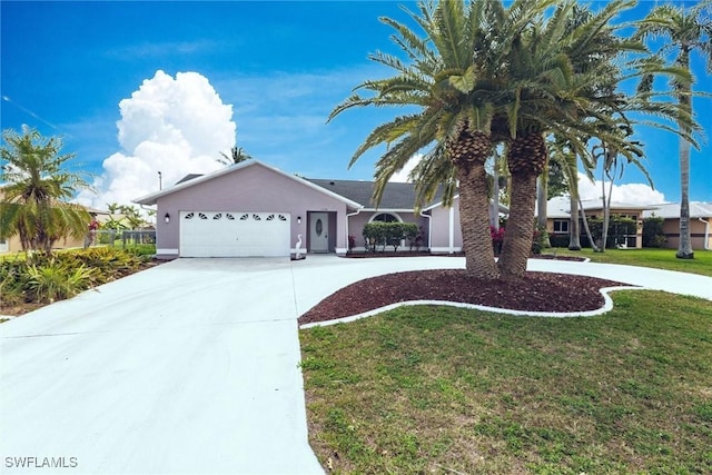 ranch-style house with concrete driveway, a front yard, an attached garage, and stucco siding