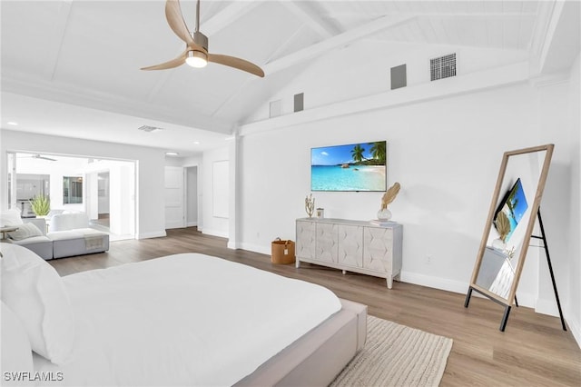 bedroom with ceiling fan, high vaulted ceiling, beam ceiling, and hardwood / wood-style floors