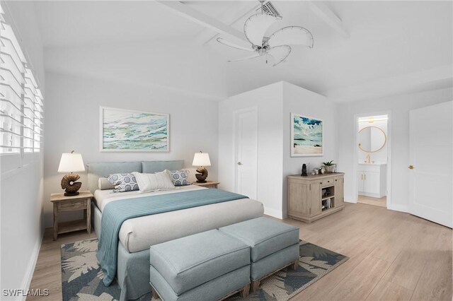 bedroom with ceiling fan, ensuite bathroom, and light wood-type flooring