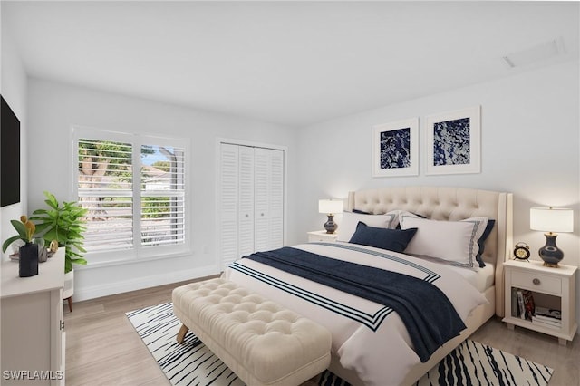 bedroom with a closet and light wood-type flooring