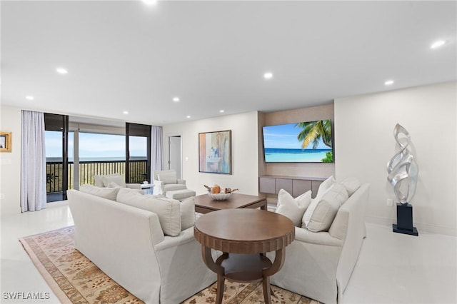 living room featuring floor to ceiling windows