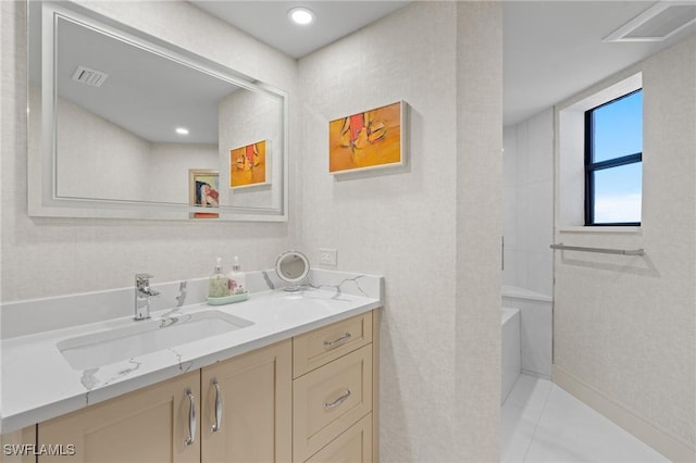 bathroom featuring tile patterned flooring and vanity