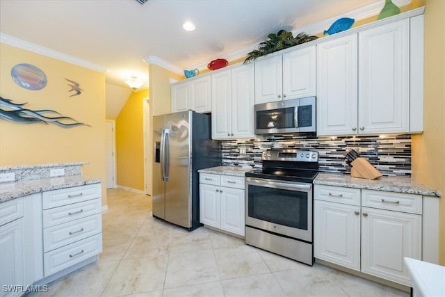 kitchen featuring stainless steel appliances, crown molding, backsplash, white cabinets, and light tile patterned flooring