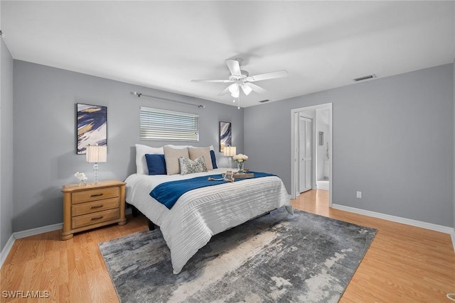 bedroom with hardwood / wood-style flooring and ceiling fan