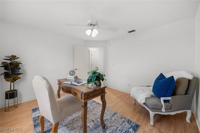 office space with ceiling fan and light hardwood / wood-style floors