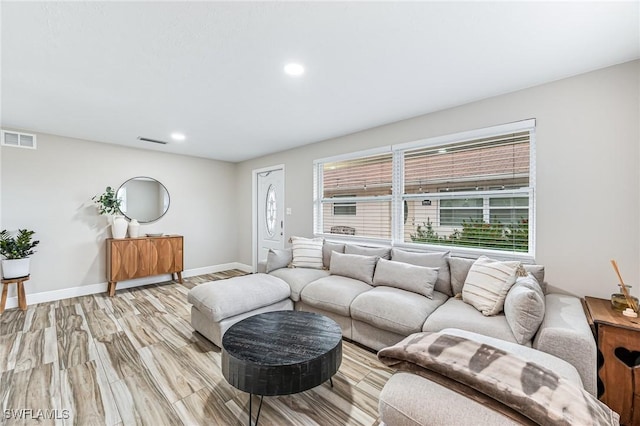 living room with light hardwood / wood-style floors