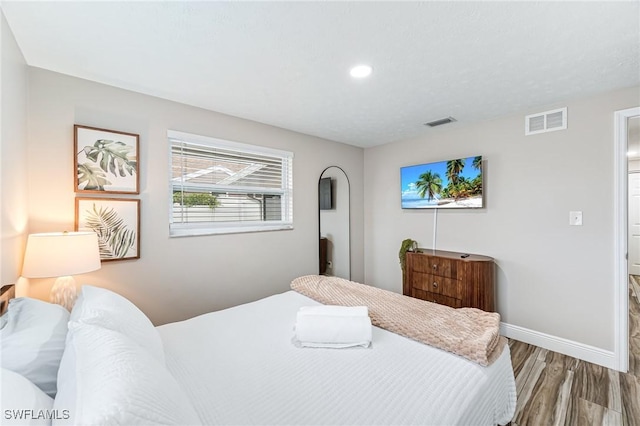 bedroom with light hardwood / wood-style flooring