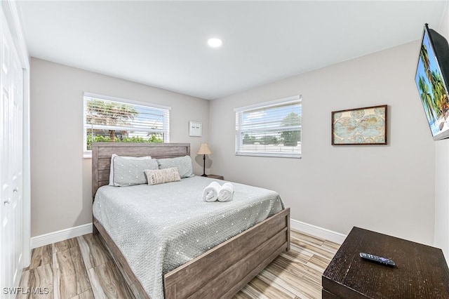 bedroom featuring a closet and light hardwood / wood-style flooring