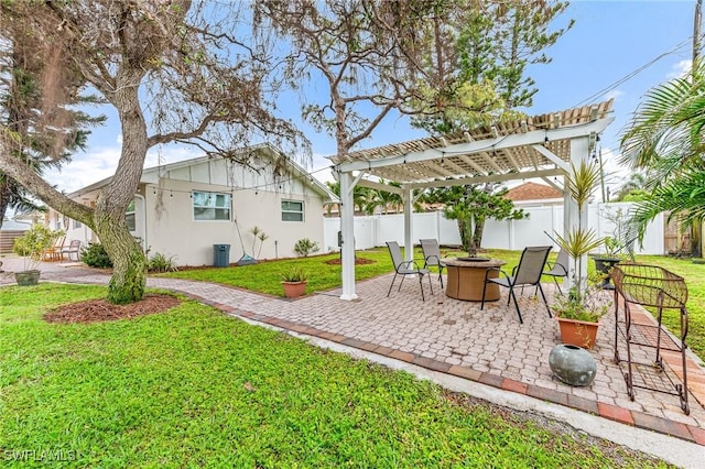 view of yard with a pergola, a patio area, and a fire pit