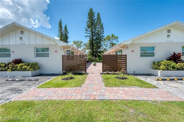 view of side of home featuring a yard