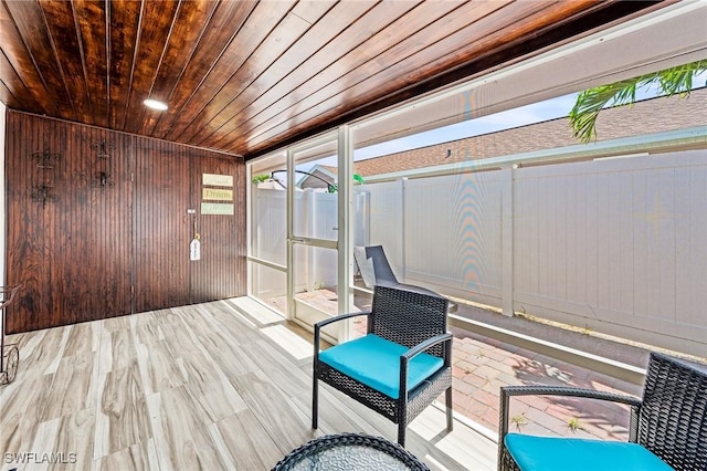 unfurnished sunroom featuring wooden ceiling