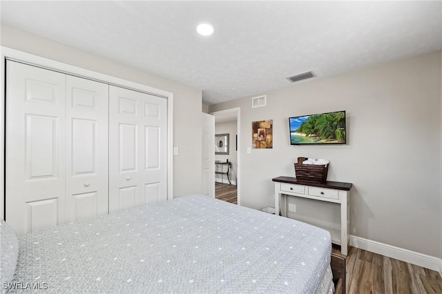 bedroom featuring a closet and hardwood / wood-style floors