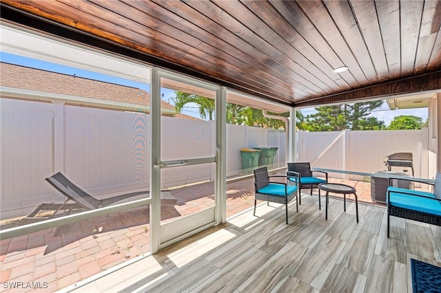 sunroom with wooden ceiling