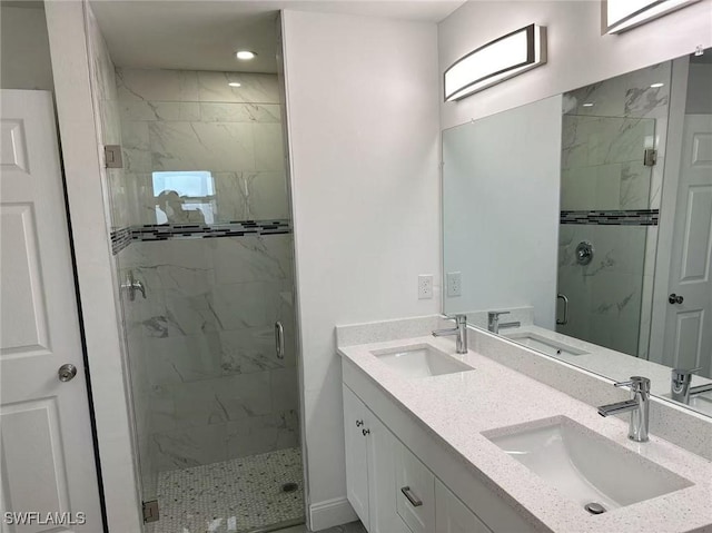 bathroom with vanity and an enclosed shower