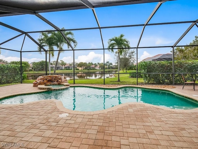 view of swimming pool featuring a water view, a patio, and glass enclosure