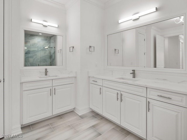 bathroom with an enclosed shower, vanity, and ornamental molding