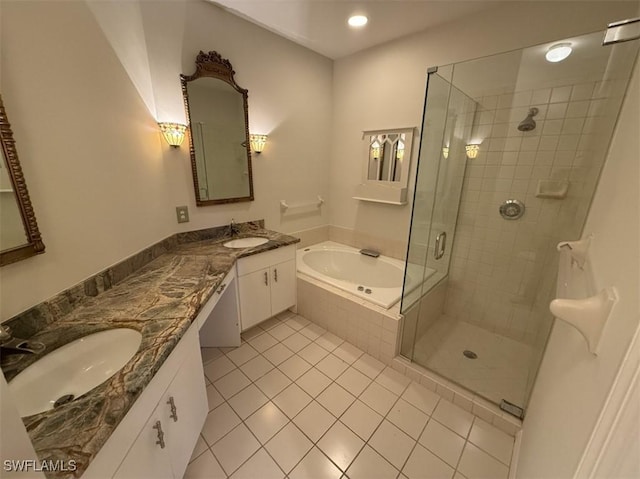 bathroom with tile patterned flooring, vanity, and independent shower and bath