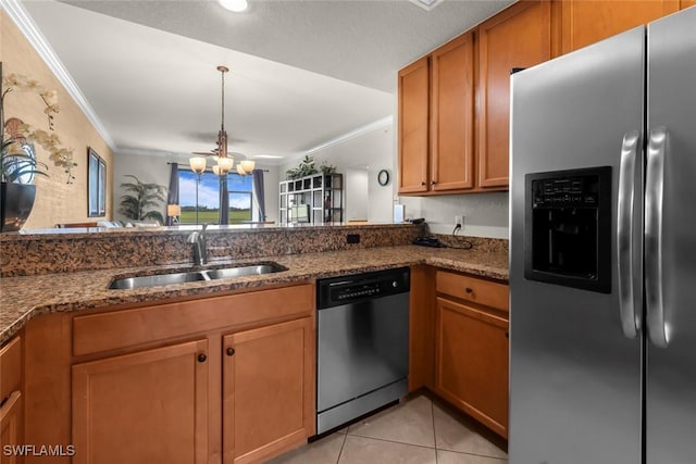 kitchen with appliances with stainless steel finishes, light tile patterned flooring, dark stone countertops, a chandelier, and sink