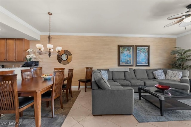 tiled living room featuring crown molding and ceiling fan with notable chandelier