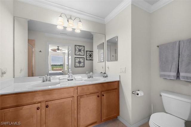 bathroom featuring ceiling fan, vanity, toilet, tile patterned floors, and crown molding